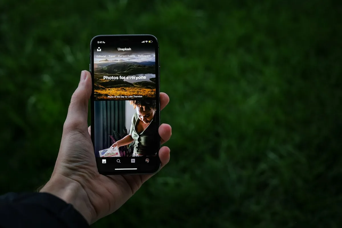 A smartphone displaying a mobile application outdoors